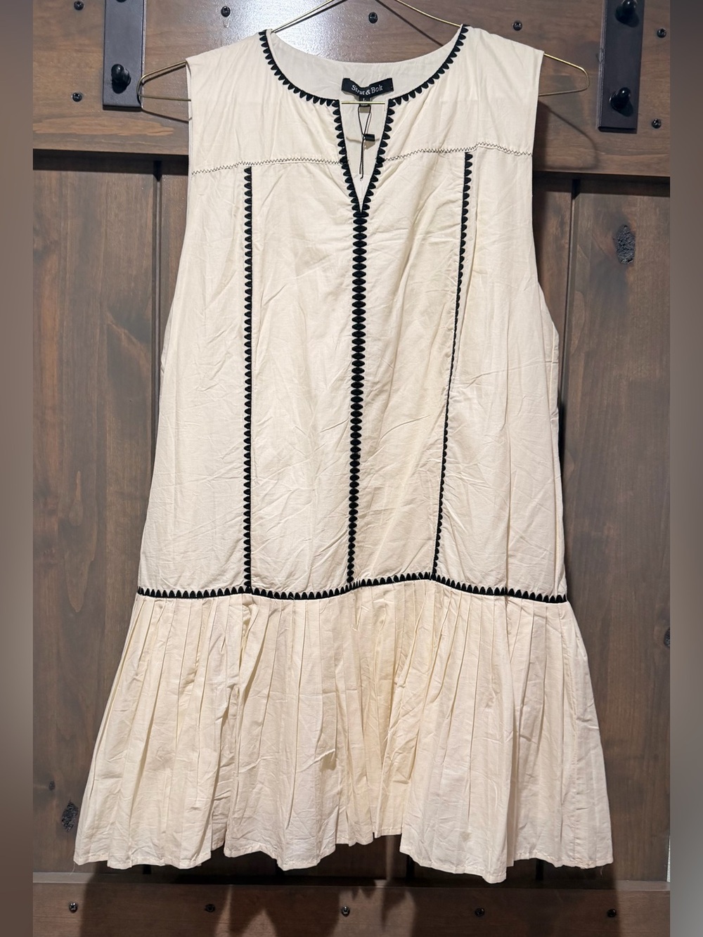 Sleeveless Cream Mini Dress with Black Trim